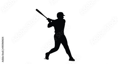 A baseball player swings for the hit in dramatic silhouette