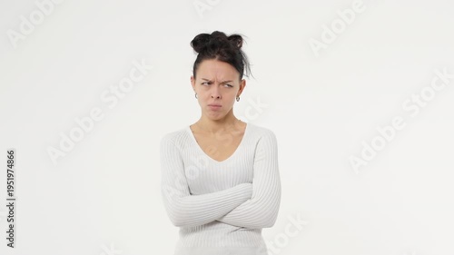 Adult young woman is angry and swearing against a white background isolated space