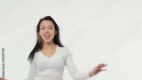 Pretty adult young woman dancing in white space background copy space