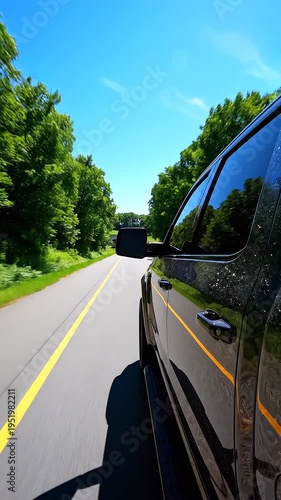 Car driving on a country road.