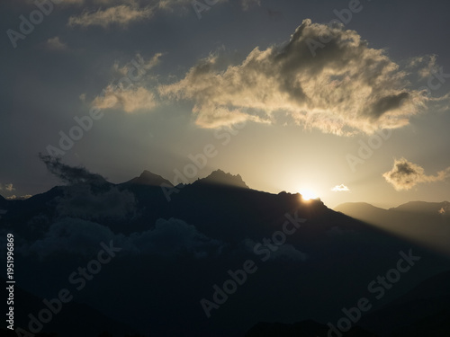 panoramic view over Muktinath in Nepal, coming down from Thorang La Pass, With the impressive Dhaulagiri II in the background At sunset