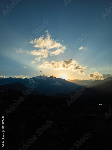 panoramic view over Muktinath in Nepal, coming down from Thorang La Pass, With the impressive Dhaulagiri II in the background At sunset