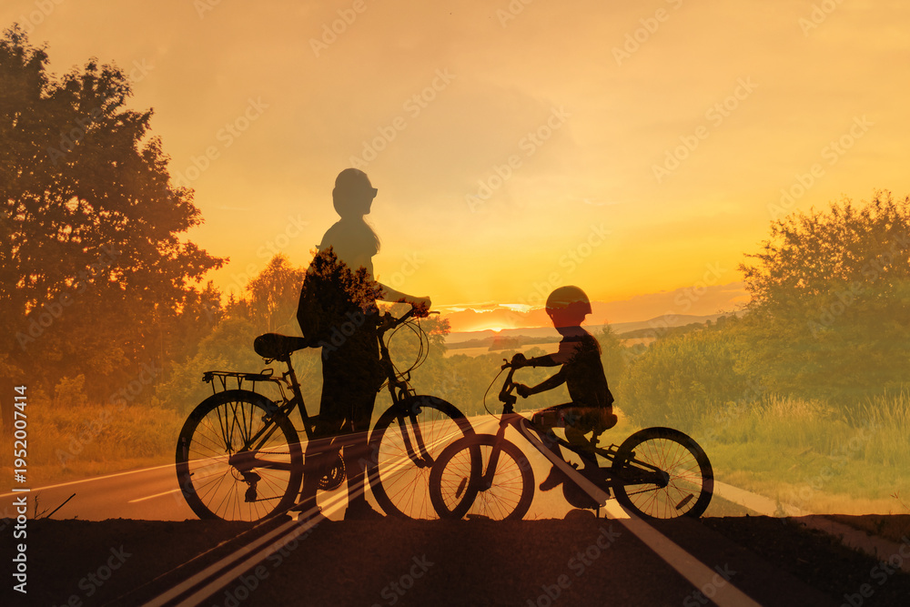 Fototapeta premium Parent and child with bicycles at sunset, family bonding and outdoor lifestyle concept