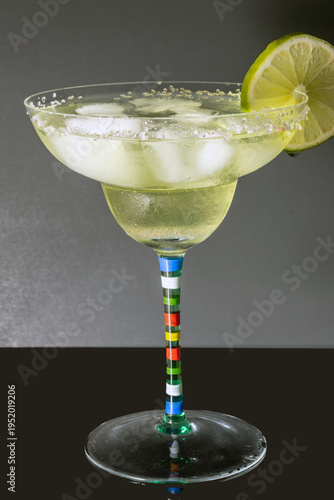 Classic margarita isolated with lime and salt rim with classic black and gray background