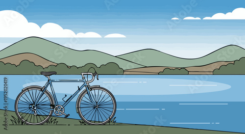A blue bicycle parked on a grassy shore next to a lake with mountains in the background.