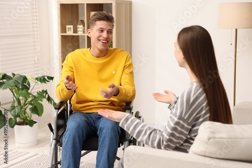 Konstfotografi Man in wheelchair with woman at home