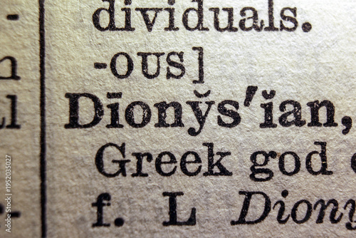 Bild auf Leinwand Word dyonisiac printed on dictionary page, macro close up
