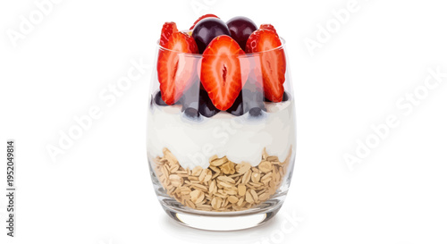 Dried fruits in a glass bowl with berries and dessert decorations