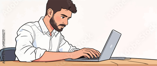 Man types on laptop while sitting at a wooden desk in a simple indoor setting during daytime