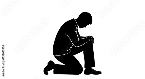 man kneeling in sorrow or prayer.
