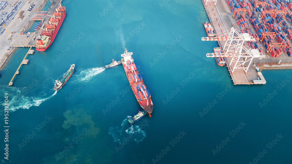 Fototapeta premium large container ship assisted by tugboats near a busy commercial port and terminal. Global maritime trade logistics, freight transport, and energy commodity supply chain concept.