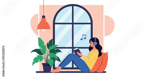 Young woman sits comfortably by a window while reading a book and listening to music with headphones in a cozy home environment.