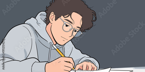 Student writes notes during study session at home in the evening while wearing glasses and a hoodie