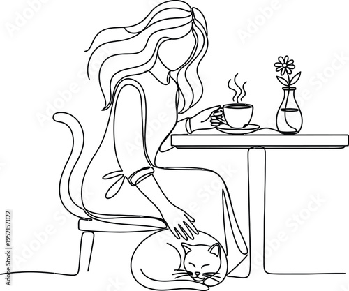 Woman sitting with cat at a table with a cup of coffee