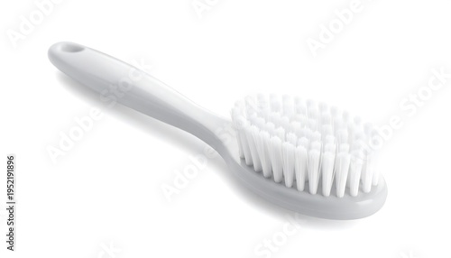 Close-up of a white oval-headed brush against a pristine white backdrop