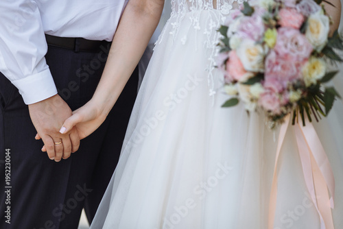 bride and groom holding hands