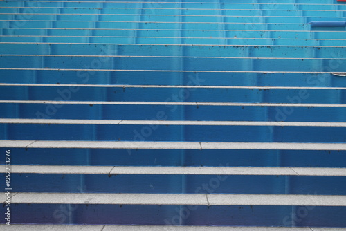Closeup of blue stairway outside of building