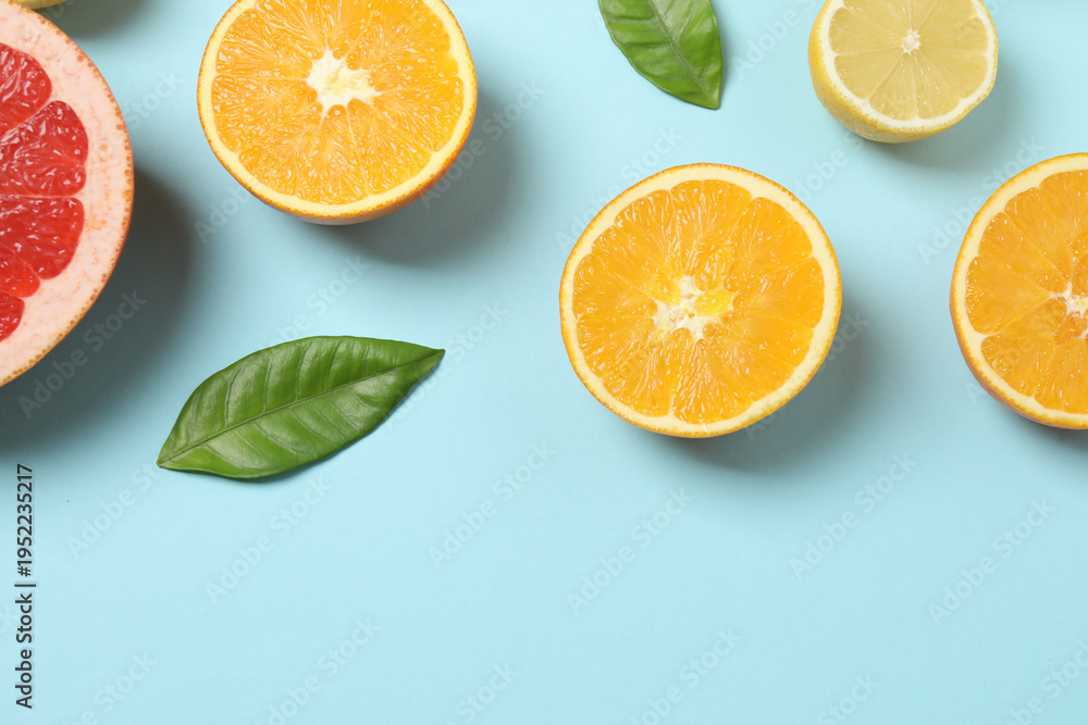 Fototapeta premium Citrus fruits, including grapefruit, lemon, orange. The concept of a source of fresh vitamin C, increasing immunity, removing toxins, natural healthy lifestyle, organic fruits. on a blue background