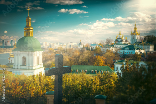 Kyiv Pechersk Lavra Orthodox Monastery at Sunset with Stone Cross and Copy Space
