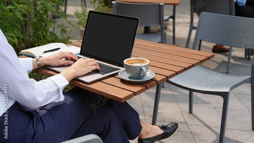 ​A woman is working, She uses a laptop, She sits at a table, She drinks some coffee, She wears professional clothes, She looks very busy, She is focused deeply, Work happens outside today, home office