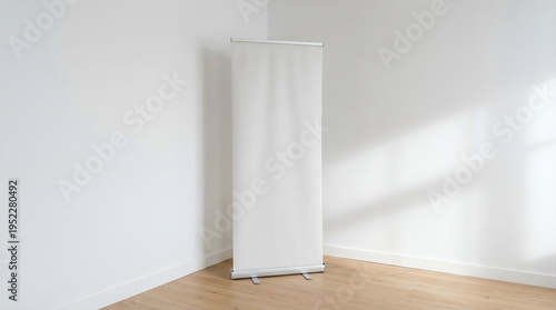 Empty white banner for a trade show or event, standing in a bright, minimalist room corner