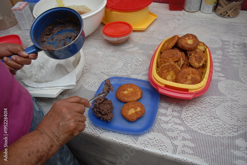 Serving beans with egg fritters on plate