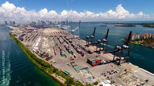 Aerial panorama of Port Miami cargo terminal and Miami city skyline. expansive container terminal, industrial gantry cranes, American maritime infrastructure, international trade logistics