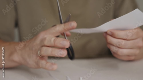 Wallpaper Mural Close-up of scissors cutting a narrow strip from a sheet of white paper. Precise manual motion demonstrating simple cutting process in craft or office environment. High quality 4k footage Torontodigital.ca