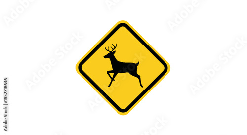 A yellow diamond road sign features a black deer silhouette, indicating animal crossing