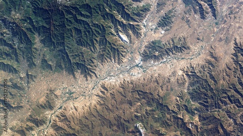 Wallpaper Mural Aerial satellite view showcasing rugged mountain ranges, a meandering river, and a valley with a town Torontodigital.ca