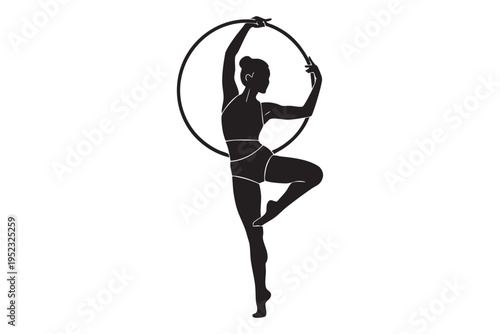 Silhouette of a woman performing aerial hoop acrobatics