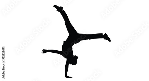 Silhouette of a person performing a dynamic handstand breakdance move