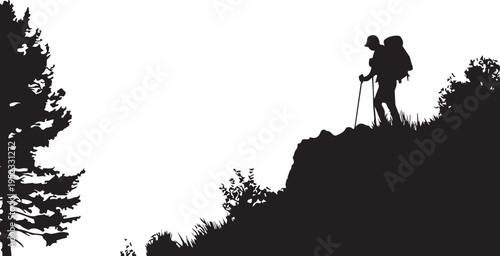 Silhouette of a hiker with a backpack standing on a rocky outcrop