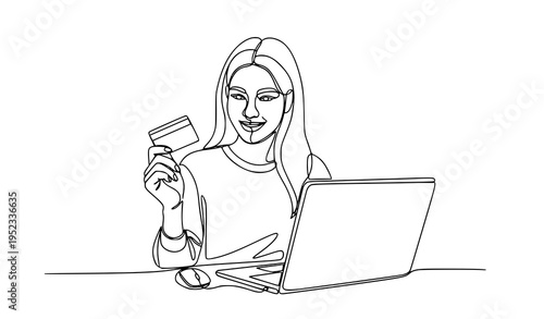 A woman holding a credit card and using a laptop for online shopping