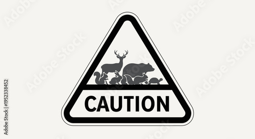 A white sign features a black triangle with animals above “CAUTION”
