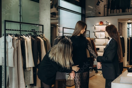 Cuadro en lienzo Boutique stylist helping customer fitting a dress