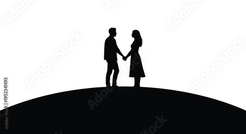 Couple holding hands on a hill a dramatic black silhouette