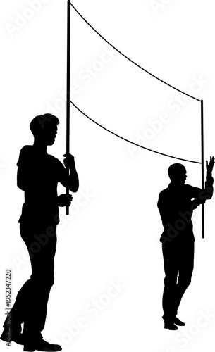Two protestors or demonstrators at a demonstration march, picket line or strike protest rally in silhouette. Holding up a banner sign.