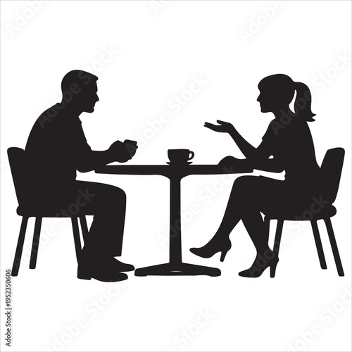 A man and woman sitting at a table talking