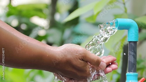 Clean Water Flowing over a hand, representing purification and refreshment
