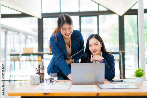 A team of business professionals analyzes financial performance, reviews charts and graphs, and collaborates on strategic planning for a modern corporate office.