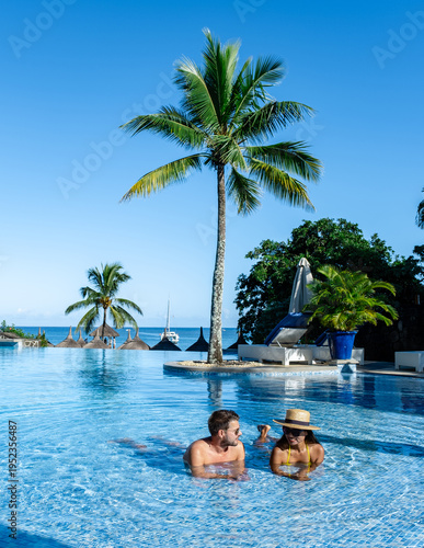 Фотография Enjoying a luxurious poolside experience in Mauritius under the clear blue sky