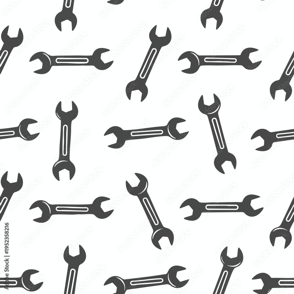 Obraz premium A seamless pattern of dark grey wrenches scattered on a white background