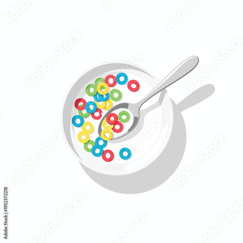 Overhead view of a white bowl filled with colorful cereal rings in milk with a spoon