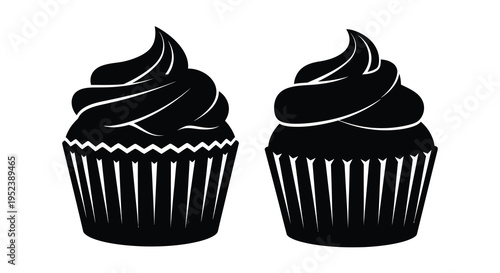 Two black cupcakes with detailed frosting a striking silhouette