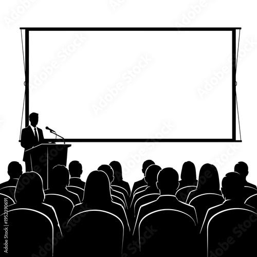 Man Presenting to Audience in Darkened Room.