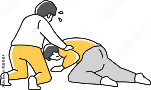 倒れた人を心配する男性