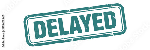 A teal rectangular stamp displaying the word delayed in bold white letters