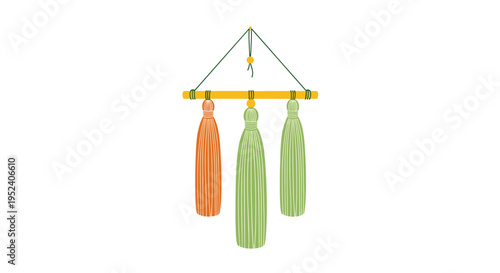 Decorative wall hanging with three long tassels in orange and green colors suspended from a wooden rod, boho style home decor.
