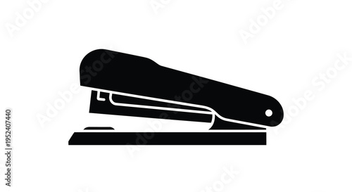 A black silhouette of a standard office stapler on a white background